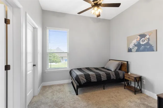 a room with a bed and a chandelier