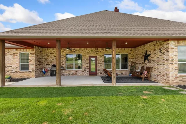 a porch with outdoor seating