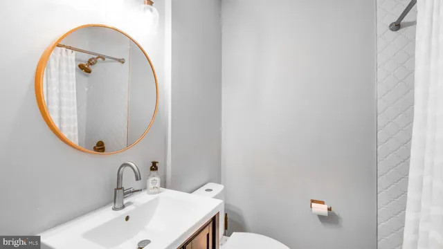 a bathroom with a double vanity sink and mirror