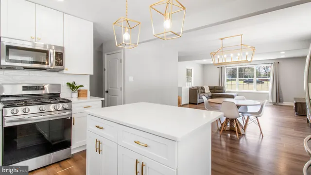 a view of a house with a yard covered in snow