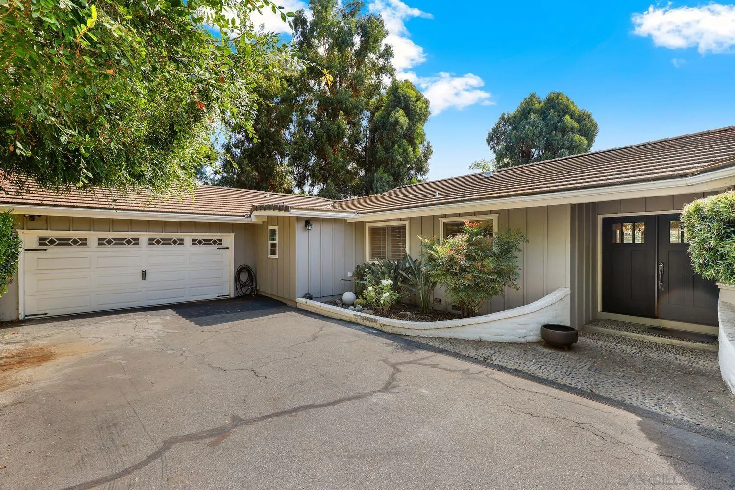 1921 Winterwarm Drive Fallbrook, CA 92028 - Photo 1 of 32 a view of a house with potted plants