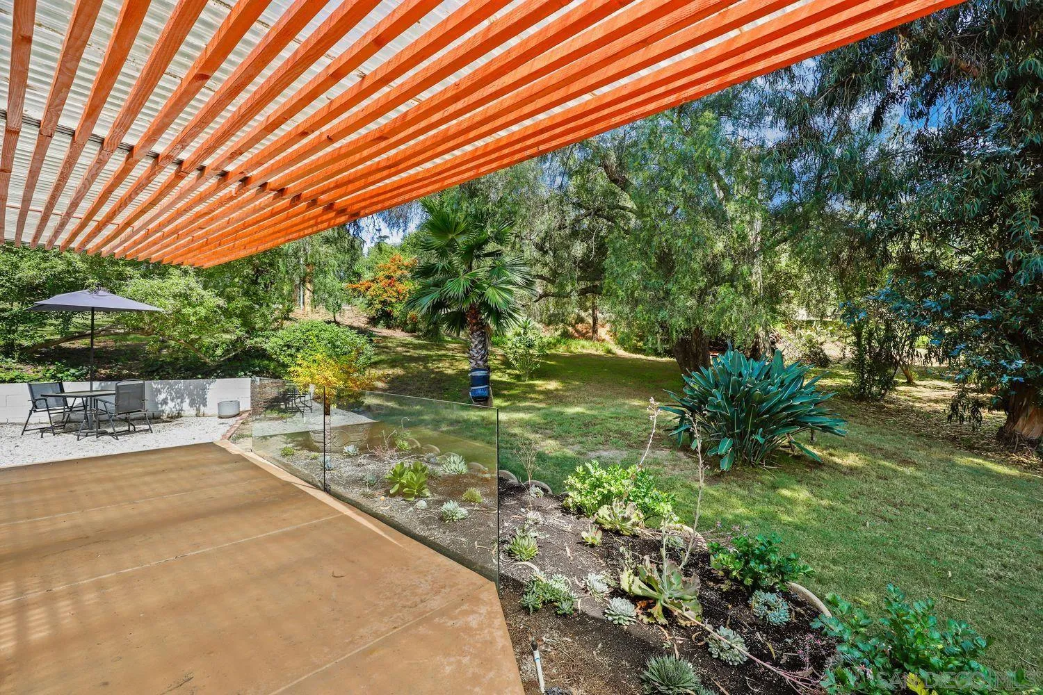 1921 Winterwarm Drive Fallbrook, CA 92028 - Photo 16 of 32 a backyard of a house with a garden and outdoor seating
