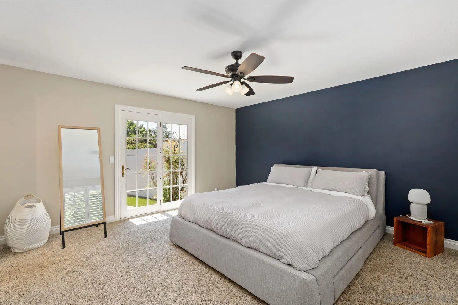 1921 Winterwarm Drive Fallbrook, CA 92028 - Photo 17 of 32 a bedroom with a large bed and a chandelier