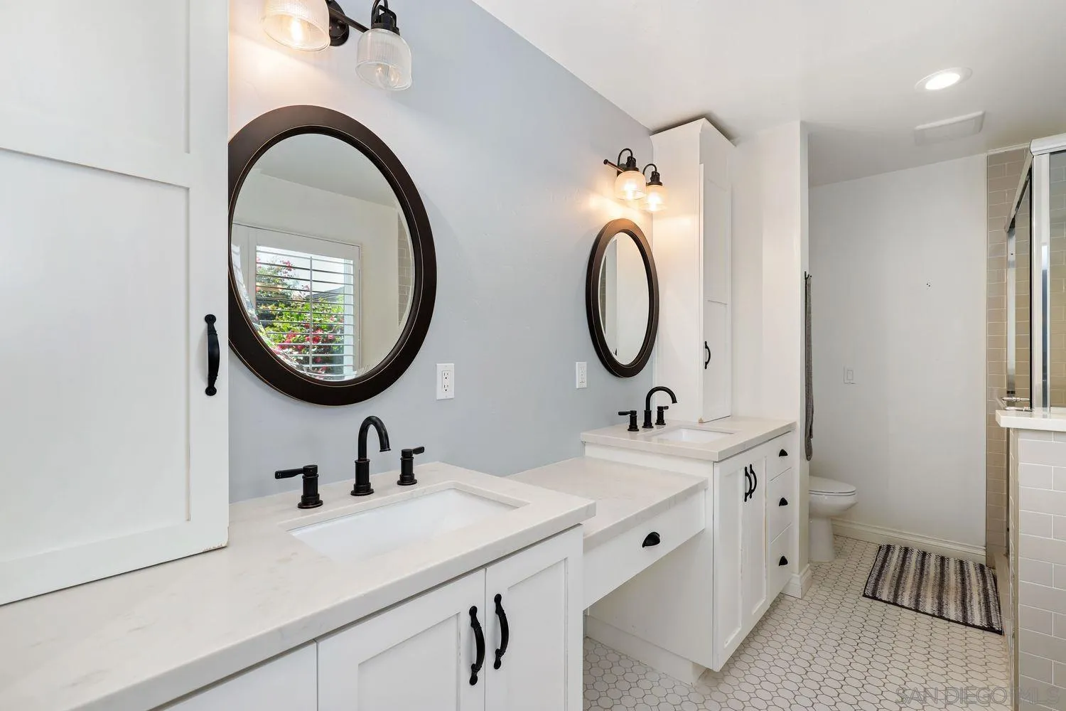 1921 Winterwarm Drive Fallbrook, CA 92028 - Photo 19 of 32 a bathroom with a sink and a mirror