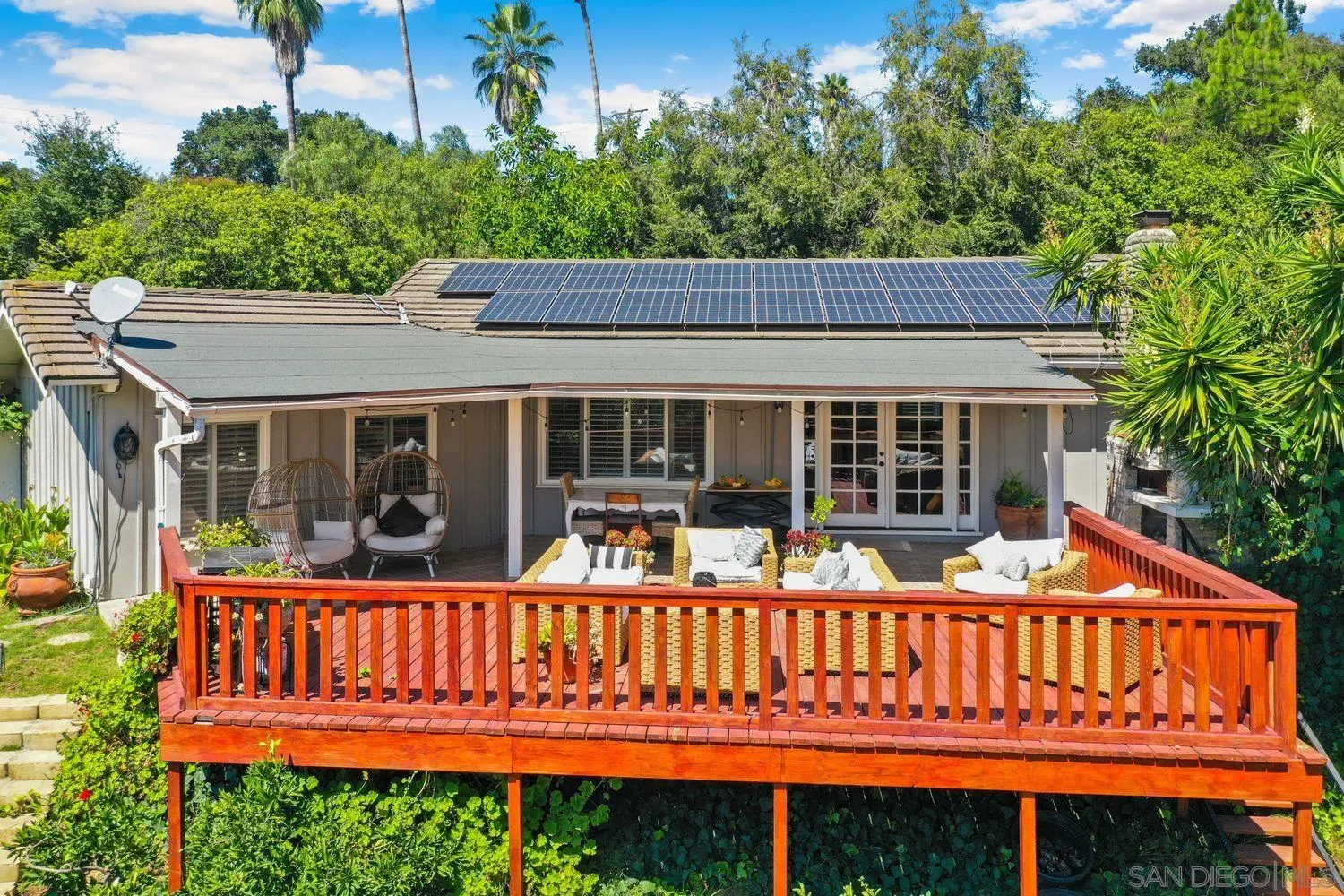 1921 Winterwarm Drive Fallbrook, CA 92028 - Photo 2 of 32 a view of a house with wooden deck and furniture