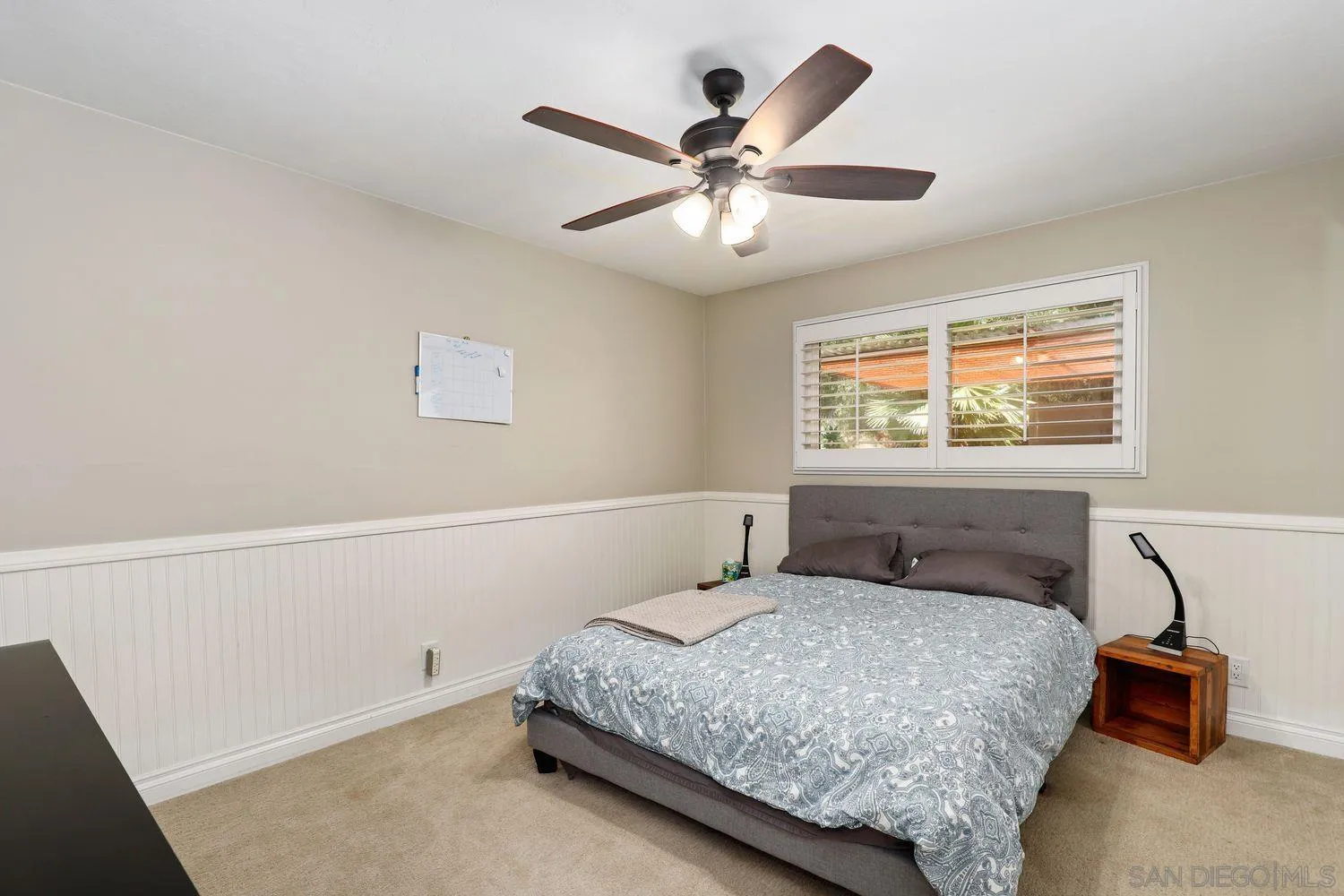 1921 Winterwarm Drive Fallbrook, CA 92028 - Photo 22 of 32 a bedroom with a bed and a chandelier
