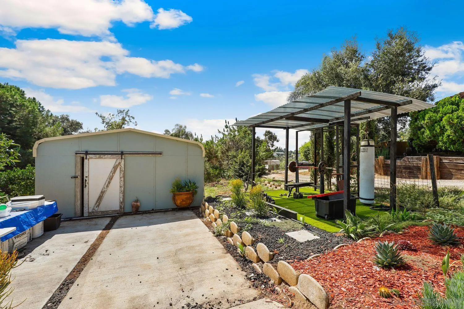 1921 Winterwarm Drive Fallbrook, CA 92028 - Photo 31 of 32 a view of a house with backyard and porch