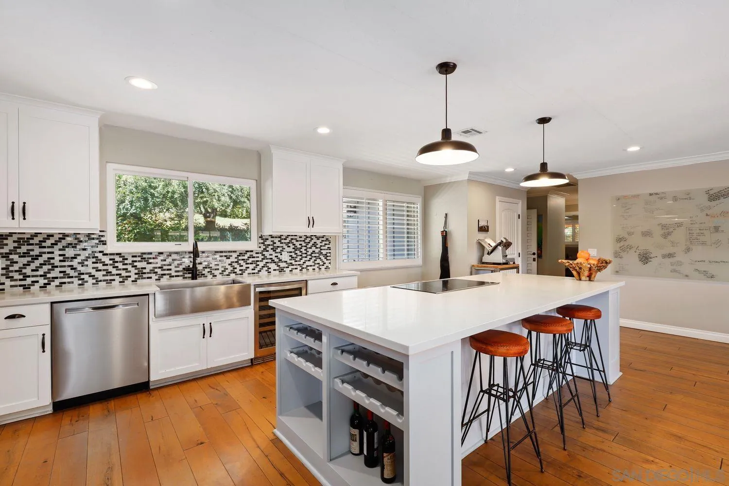 1921 Winterwarm Drive Fallbrook, CA 92028 - Photo 5 of 32 a large kitchen with kitchen island a large island in the center