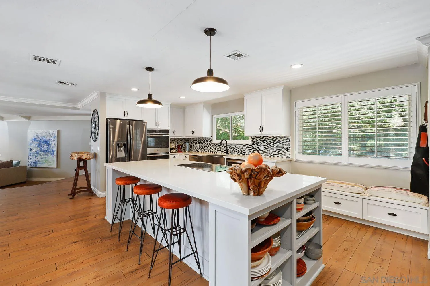 1921 Winterwarm Drive Fallbrook, CA 92028 - Photo 6 of 32 a view of a dining room and livingroom with furniture wooden floor a chandelier