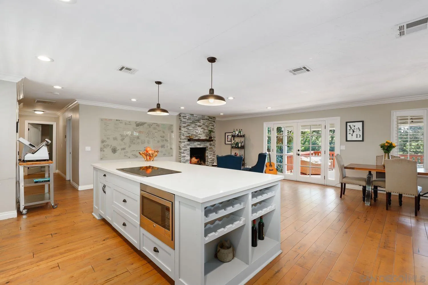 1921 Winterwarm Drive Fallbrook, CA 92028 - Photo 7 of 32 a large kitchen with stainless steel appliances granite countertop a stove and wooden floor