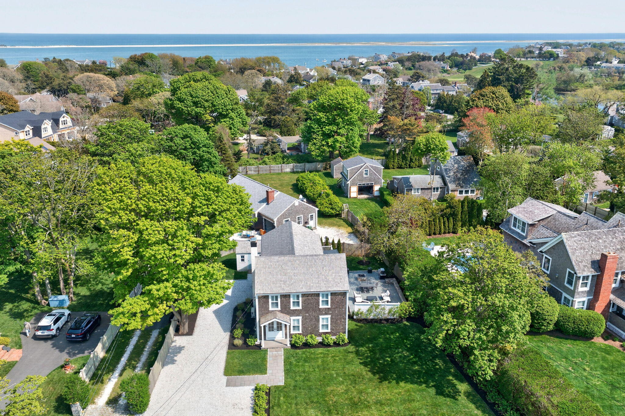 320 Old Harbor Road Chatham, MA 02633 - Photo 49 of 58 an aerial view of a house with a yard and lake view