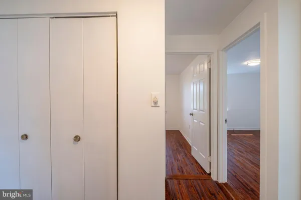 a view of a room with wooden floor