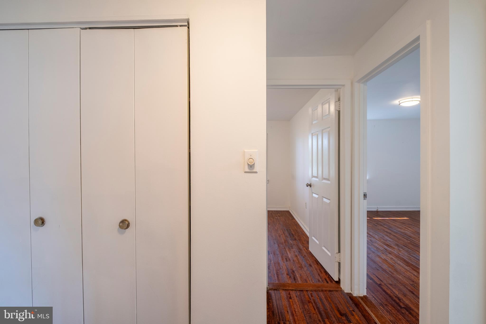 9637 Horizon Run Road, Unit 2H Montgomery Village, MD 20886 - Photo 16 of 28 a view of a room with wooden floor