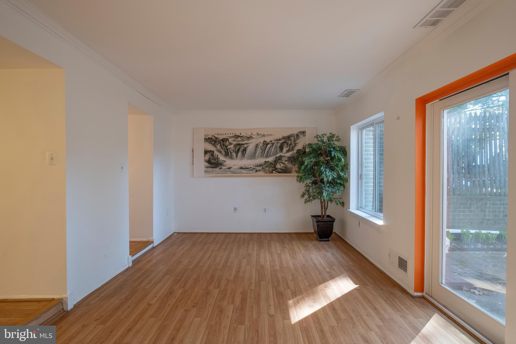 9637 Horizon Run Road, Unit 2H Montgomery Village, MD 20886 - Photo 8 of 28 a view of a room with wooden floor and a window