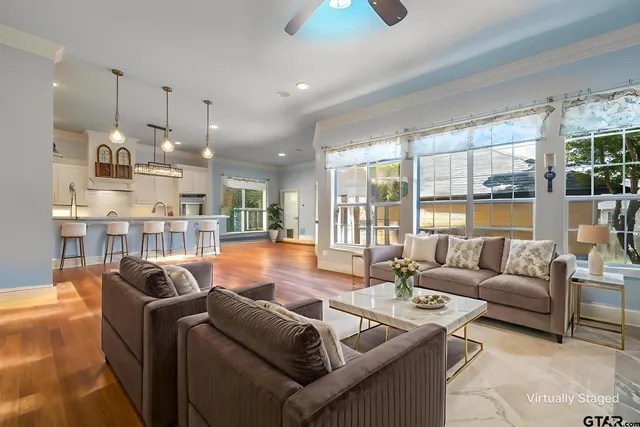 a living room with furniture and a large window