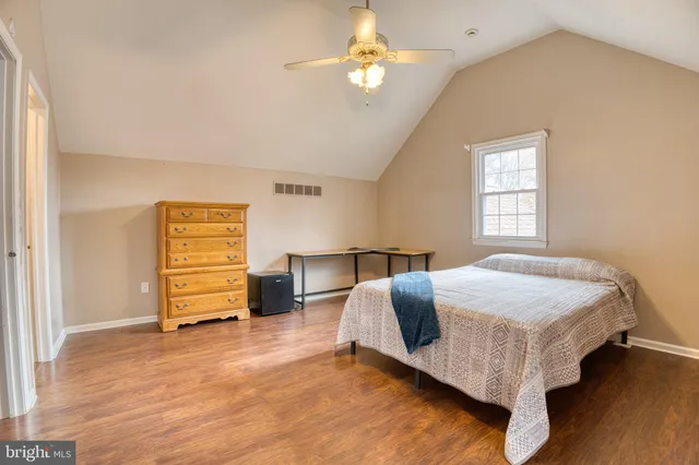 a bed room with a bed and a chandelier