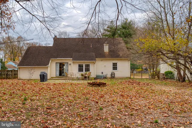a house that has a tree in front of it