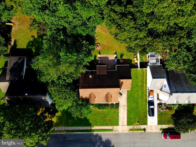 an aerial view of a house with a garden