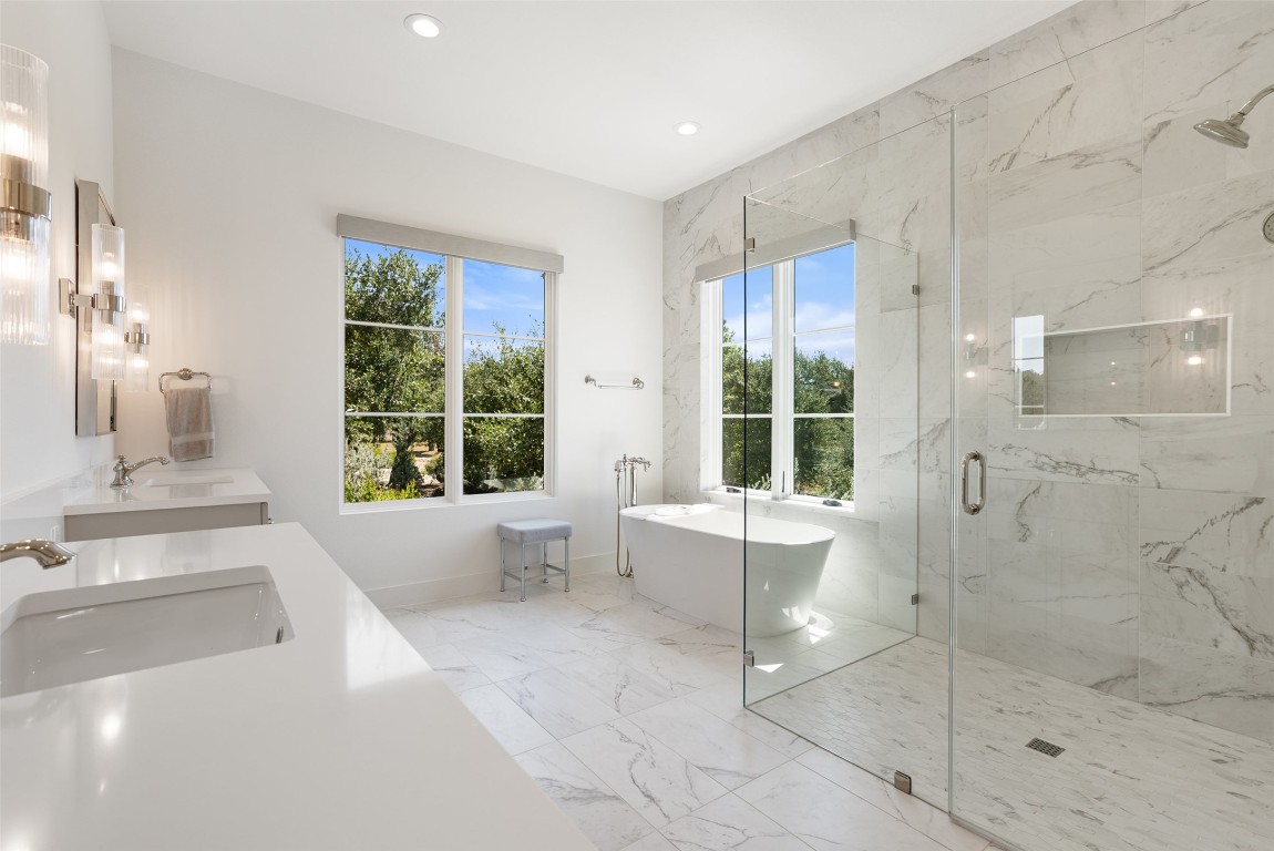 15236 Grumbles Lane Austin, TX 78738 - Photo 11 of 37 a bathroom with a bathtub and sink