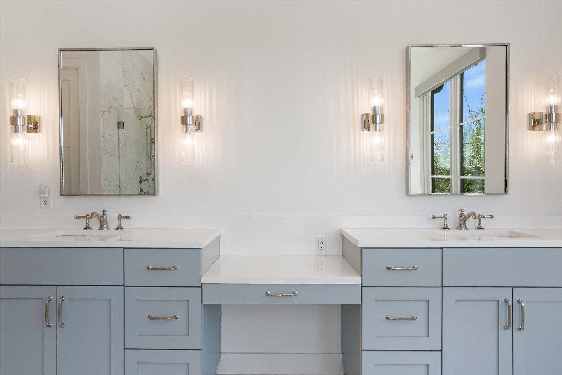 15236 Grumbles Lane Austin, TX 78738 - Photo 14 of 37 a bathroom with a sink and a mirror