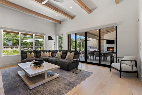 a kitchen with stainless steel appliances granite countertop a sink a stove and a refrigerator