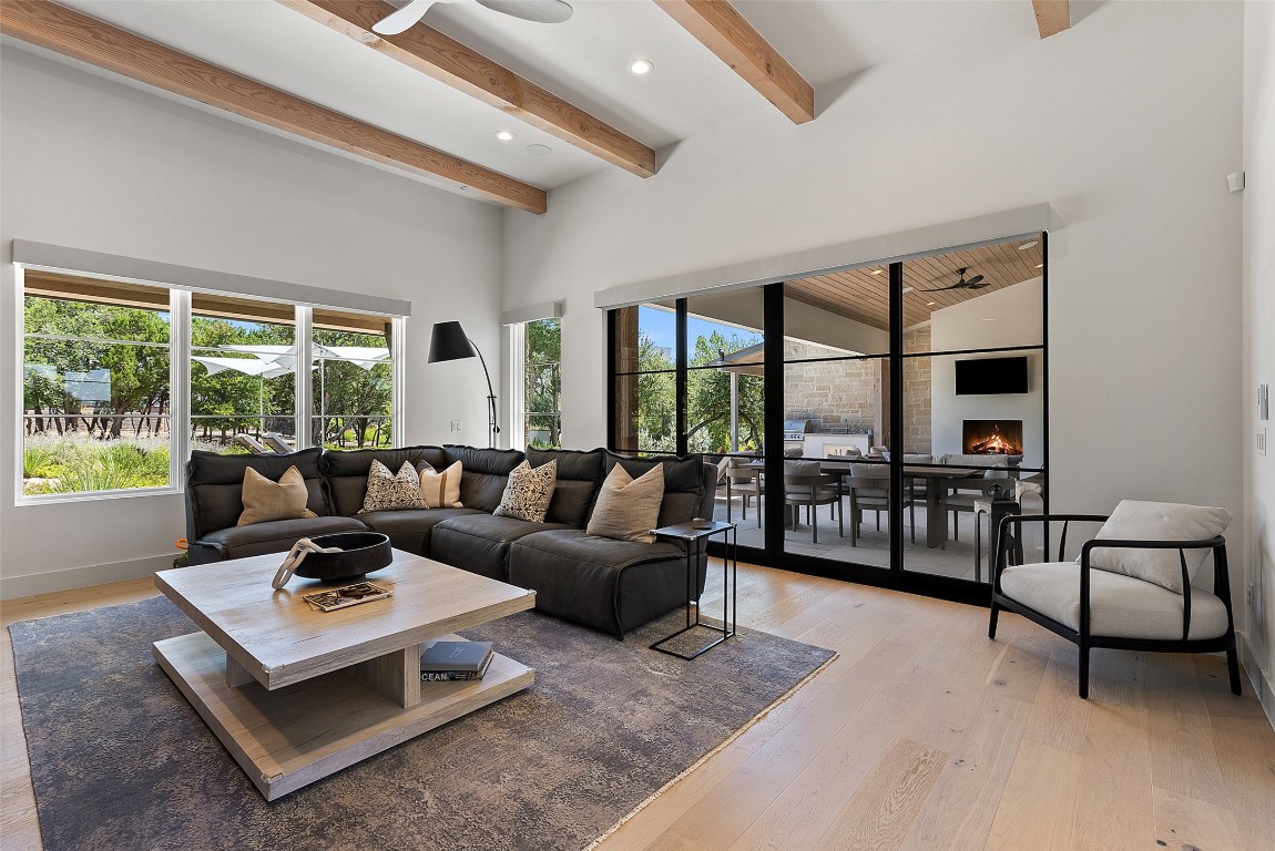 15236 Grumbles Lane Austin, TX 78738 - Photo 22 of 37 a living room with furniture and a large window