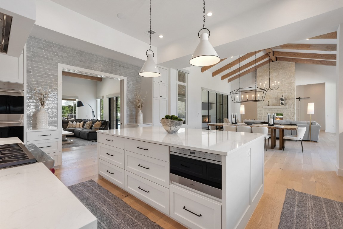 15236 Grumbles Lane Austin, TX 78738 - Photo 37 of 37 a kitchen with stainless steel appliances a stove a sink and a refrigerator