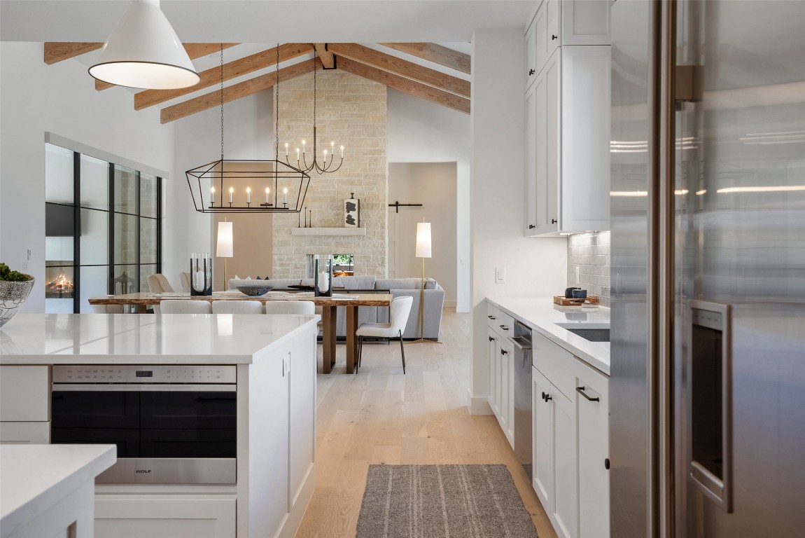 15236 Grumbles Lane Austin, TX 78738 - Photo 24 of 37 a large white kitchen with a stove and a refrigerator