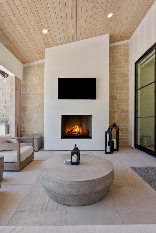 15236 Grumbles Lane Austin, TX 78738 - Photo 28 of 37 a living room with furniture a flat screen tv and a fireplace