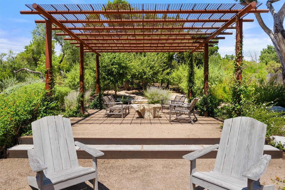 15236 Grumbles Lane Austin, TX 78738 - Photo 31 of 37 a view of a patio with table and chairs and potted plants