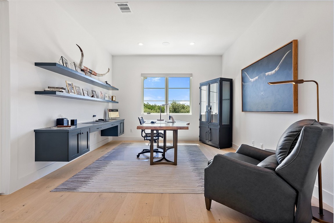 15236 Grumbles Lane Austin, TX 78738 - Photo 32 of 37 a living room with furniture and a table