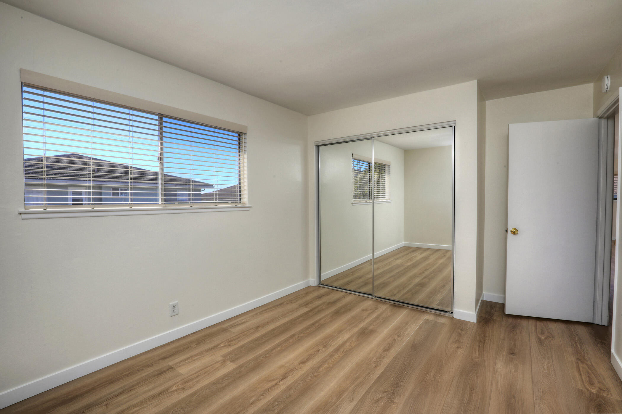 5945 Hickory Street, Unit 4 Carpinteria, CA 93013 - Photo 7 of 19 a view of empty room with wooden floor and fan