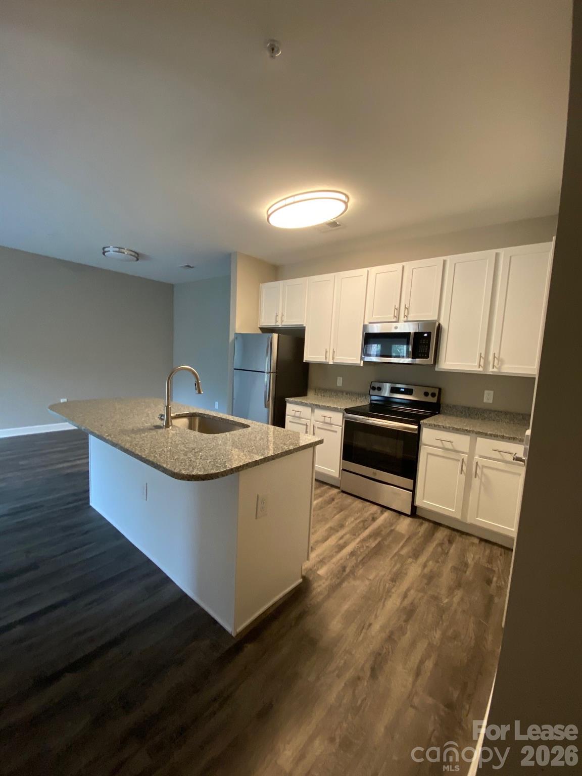 90 Riverside Drive Hickory, NC 28601 - Photo 7 of 15 a kitchen with stainless steel appliances granite countertop a sink a stove a microwave a sink a refrigerator and cabinets