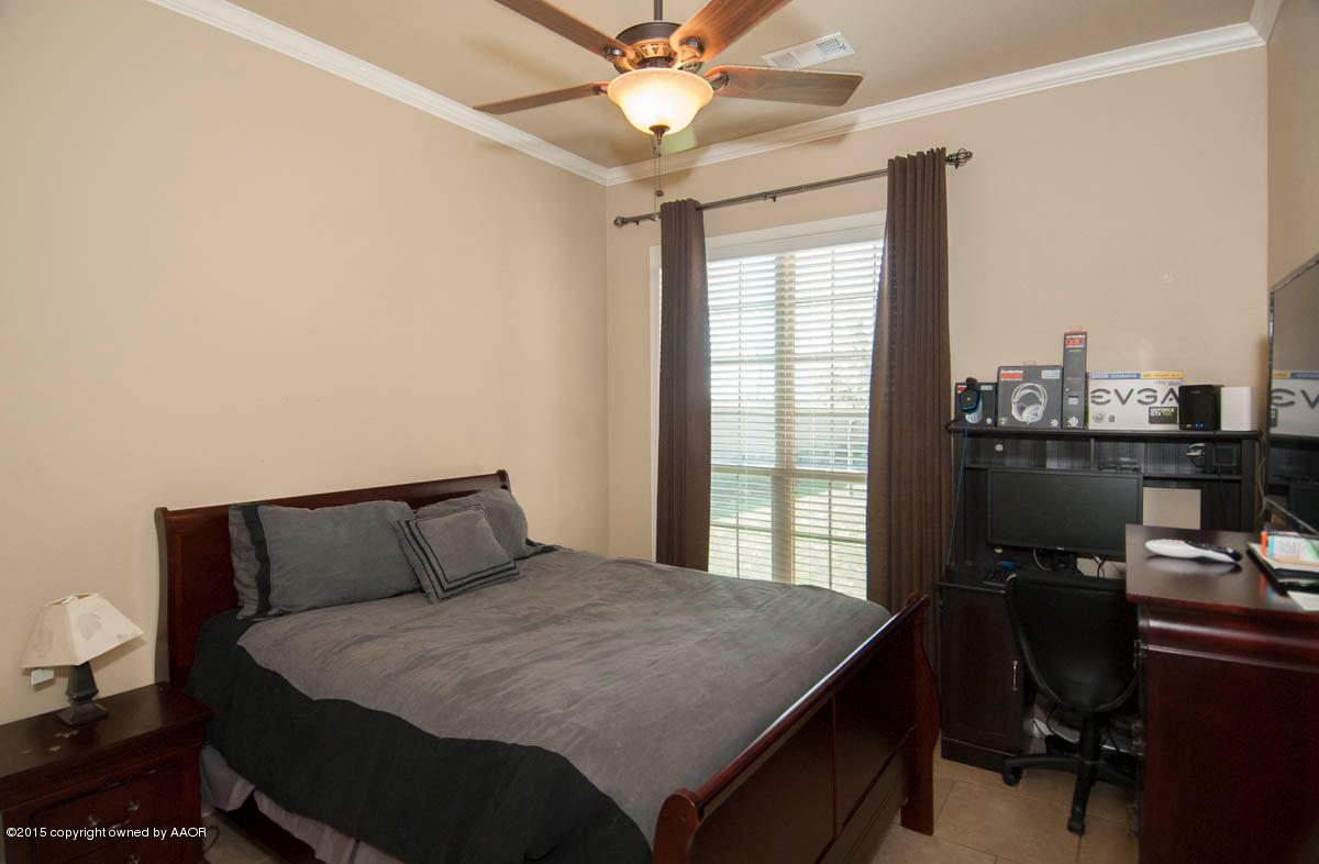 3817 Arden Road Amarillo, TX 79118 - Photo 17 of 30 a bedroom with a bed and a window