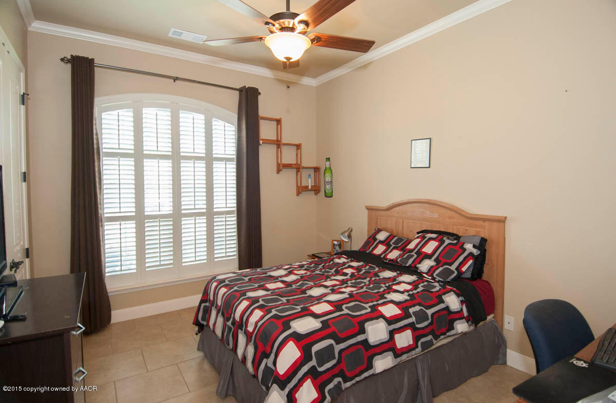 3817 Arden Road Amarillo, TX 79118 - Photo 21 of 30 a bedroom with a large bed and a window