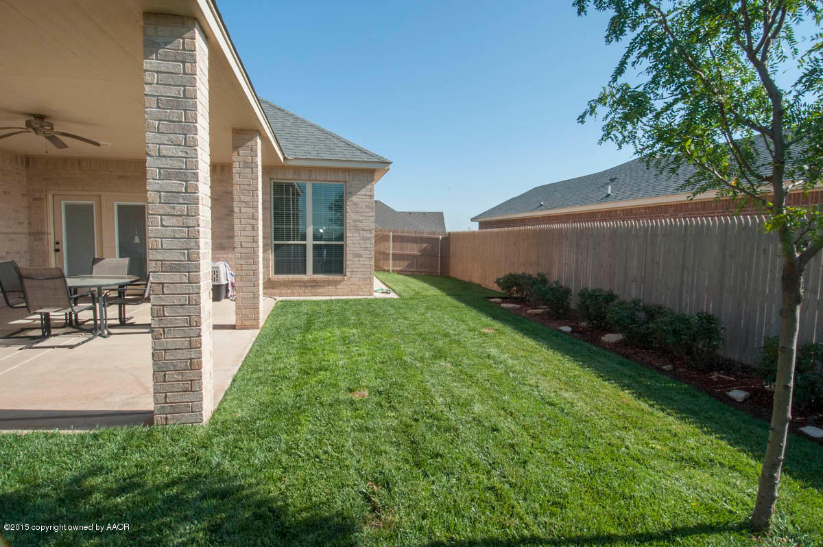 3817 Arden Road Amarillo, TX 79118 - Photo 27 of 30 a view of backyard with potted plants and a large tree