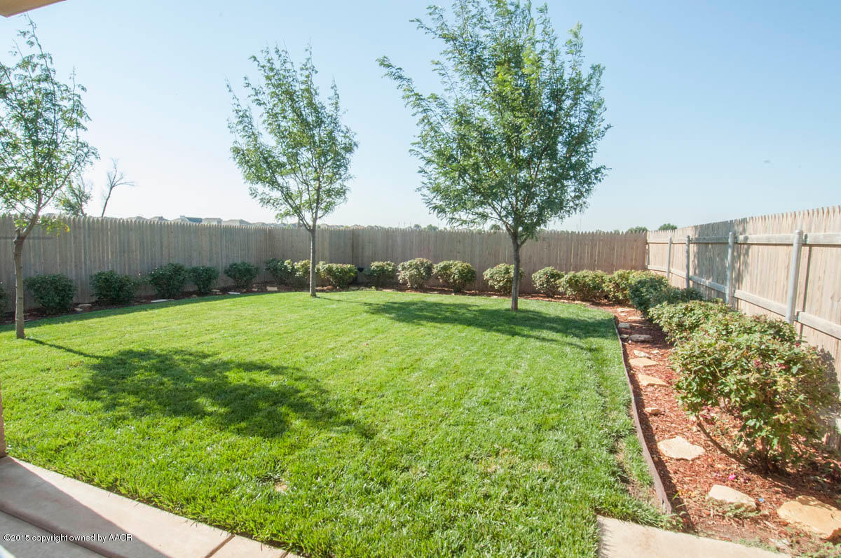 3817 Arden Road Amarillo, TX 79118 - Photo 30 of 30 a view of a backyard with large trees