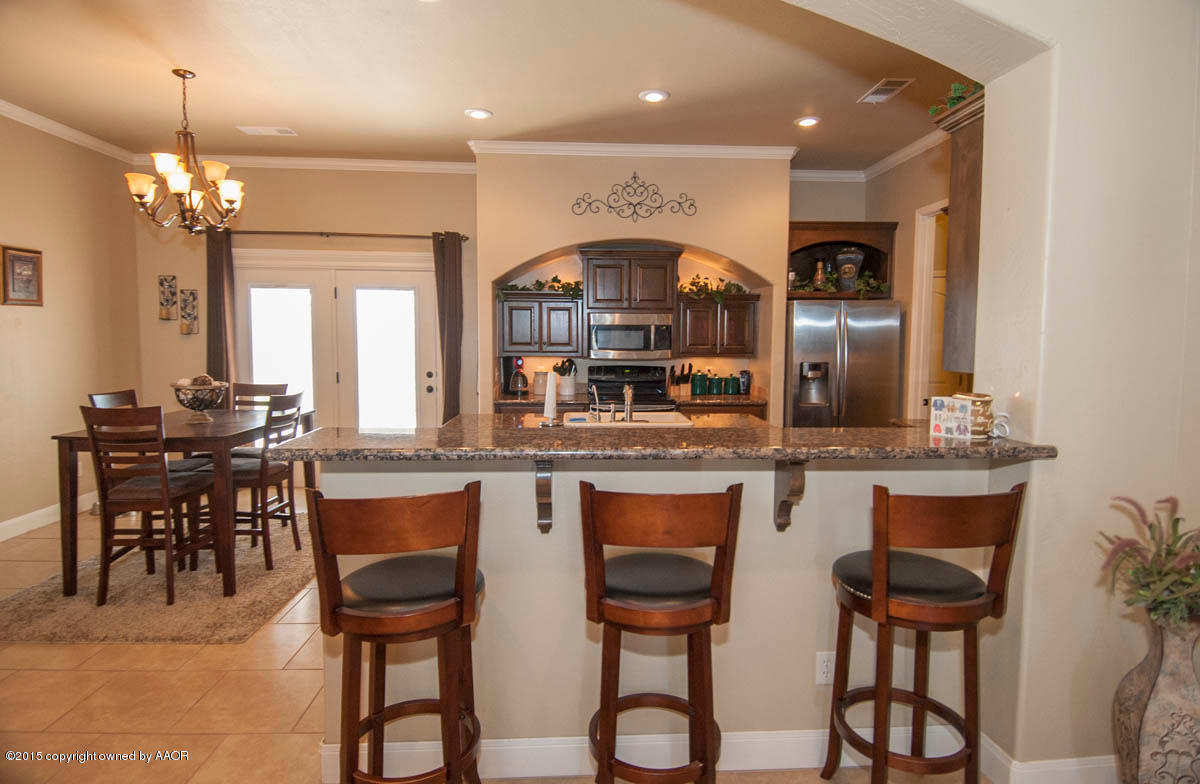 3817 Arden Road Amarillo, TX 79118 - Photo 6 of 30 a kitchen with a table and chairs in it