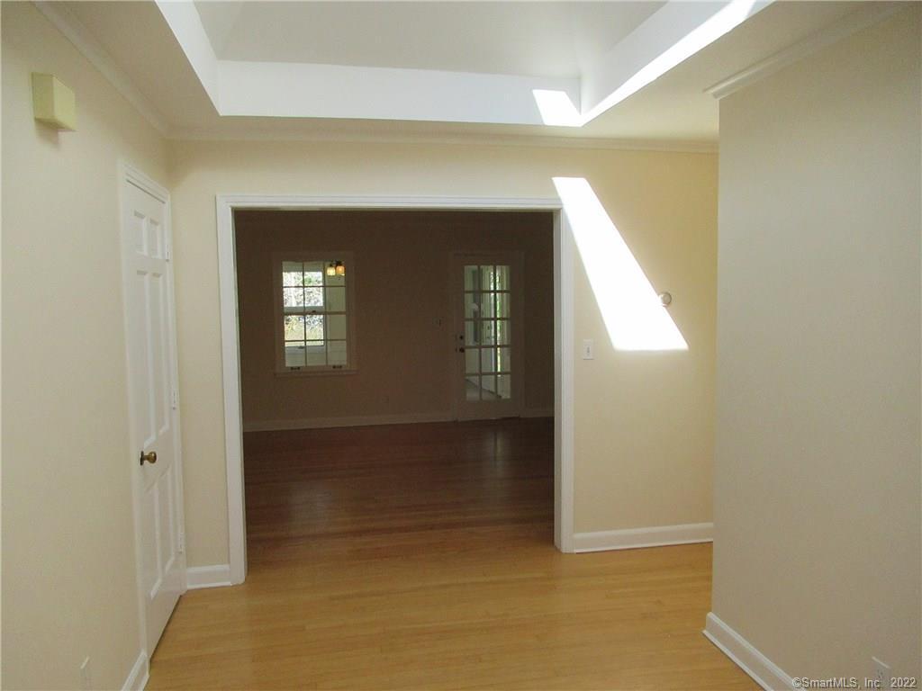 11 Burnt Swamp Road Woodbridge, CT 06525 - Photo 5 of 29 a view of a hallway with wooden floor