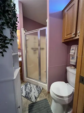 a bathroom with a toilet a sink and tub