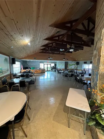 a outdoor kitchen with a stove and a table