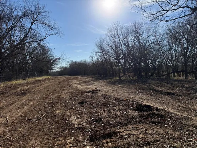 a view of a lake with a yard