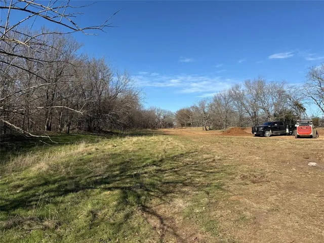 a view of backyard with green space
