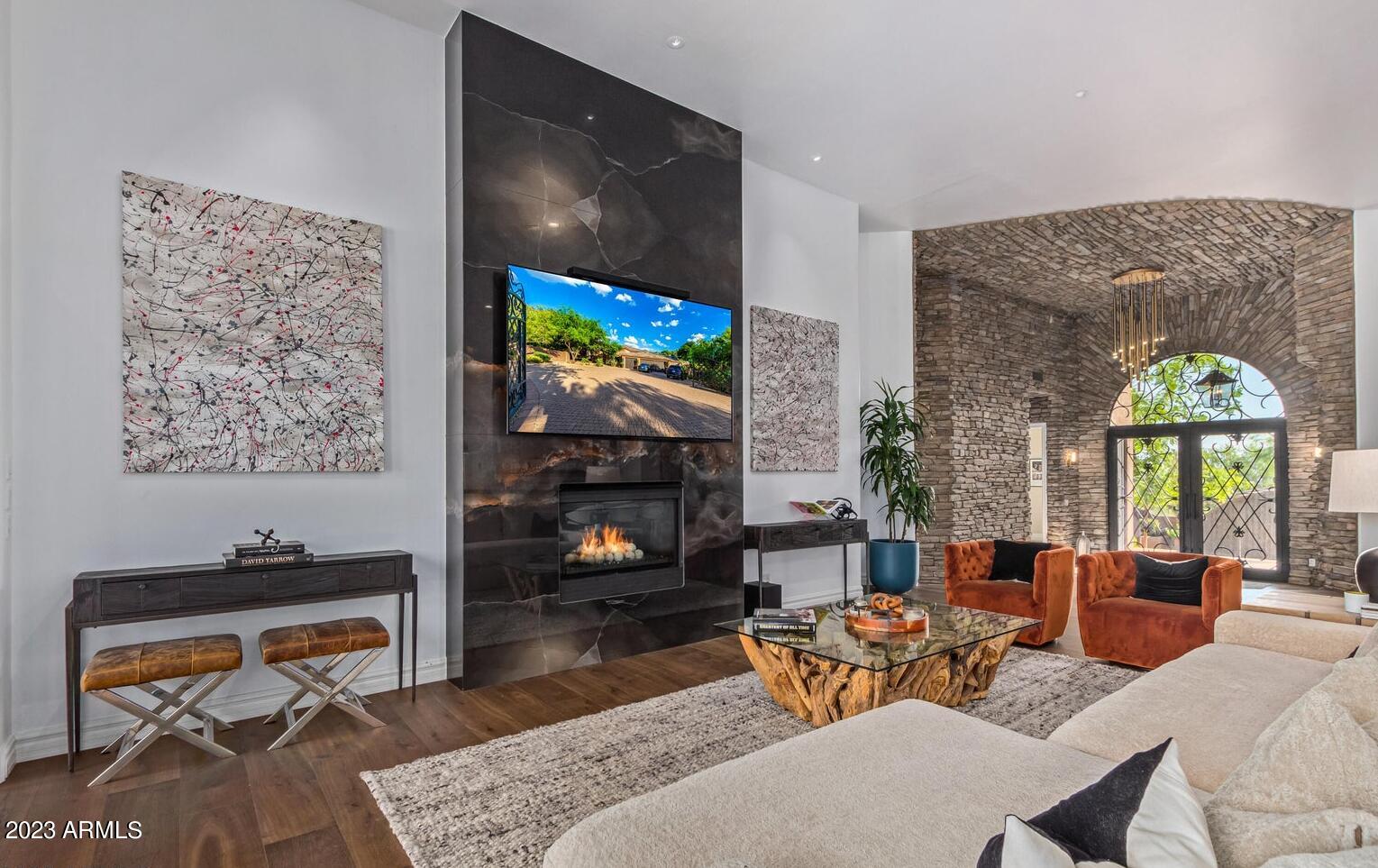 16469 North 113th Way Scottsdale, AZ 85255 - Photo 12 of 47 a living room with fireplace furniture and a flat screen tv