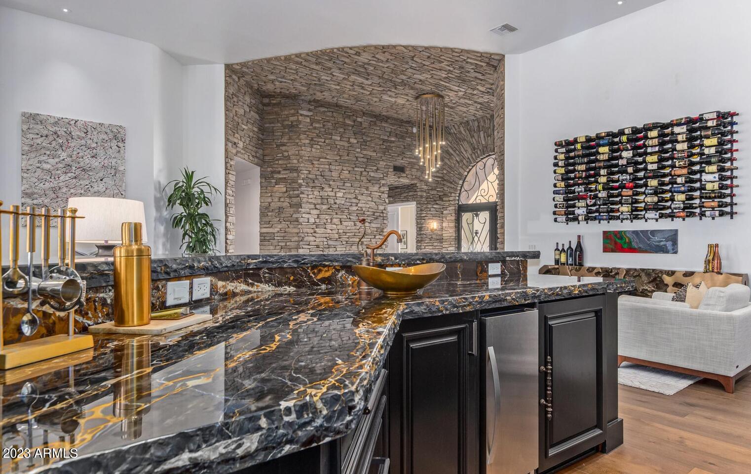 16469 North 113th Way Scottsdale, AZ 85255 - Photo 13 of 47 a kitchen with stainless steel appliances granite countertop a sink stove and cabinets