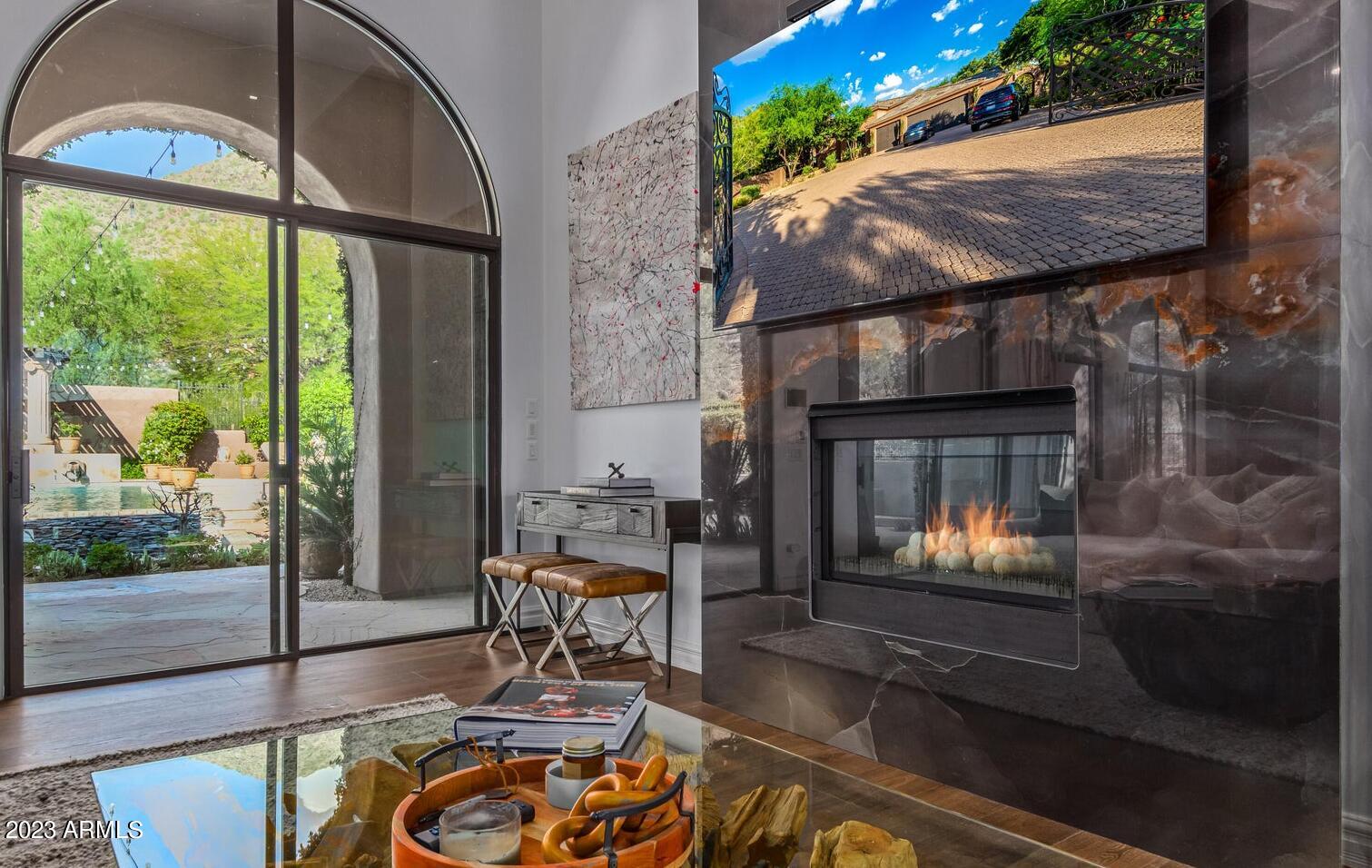 16469 North 113th Way Scottsdale, AZ 85255 - Photo 16 of 47 a living room with furniture and a fireplace