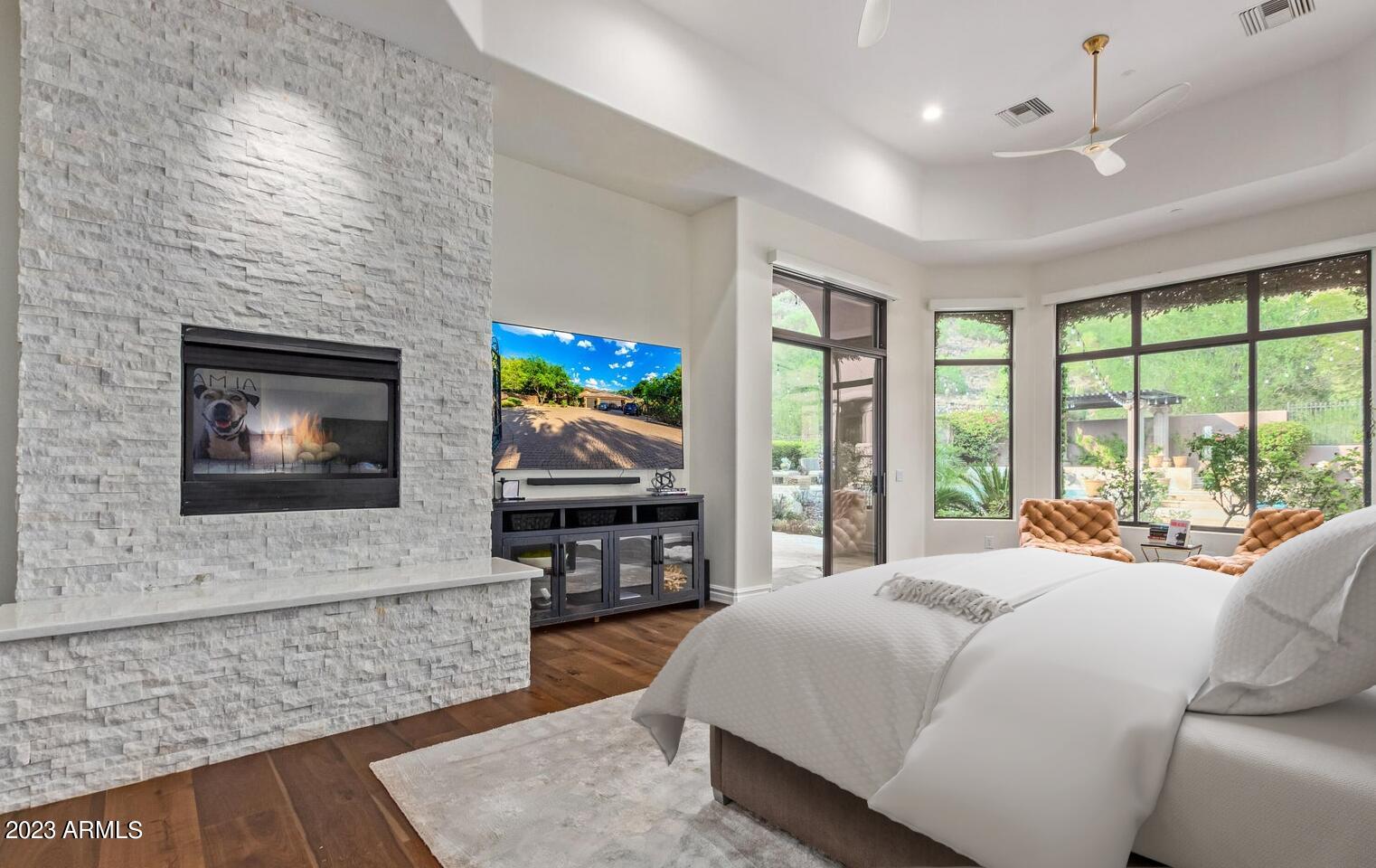 16469 North 113th Way Scottsdale, AZ 85255 - Photo 20 of 47 a bedroom with a bed and a flat screen tv