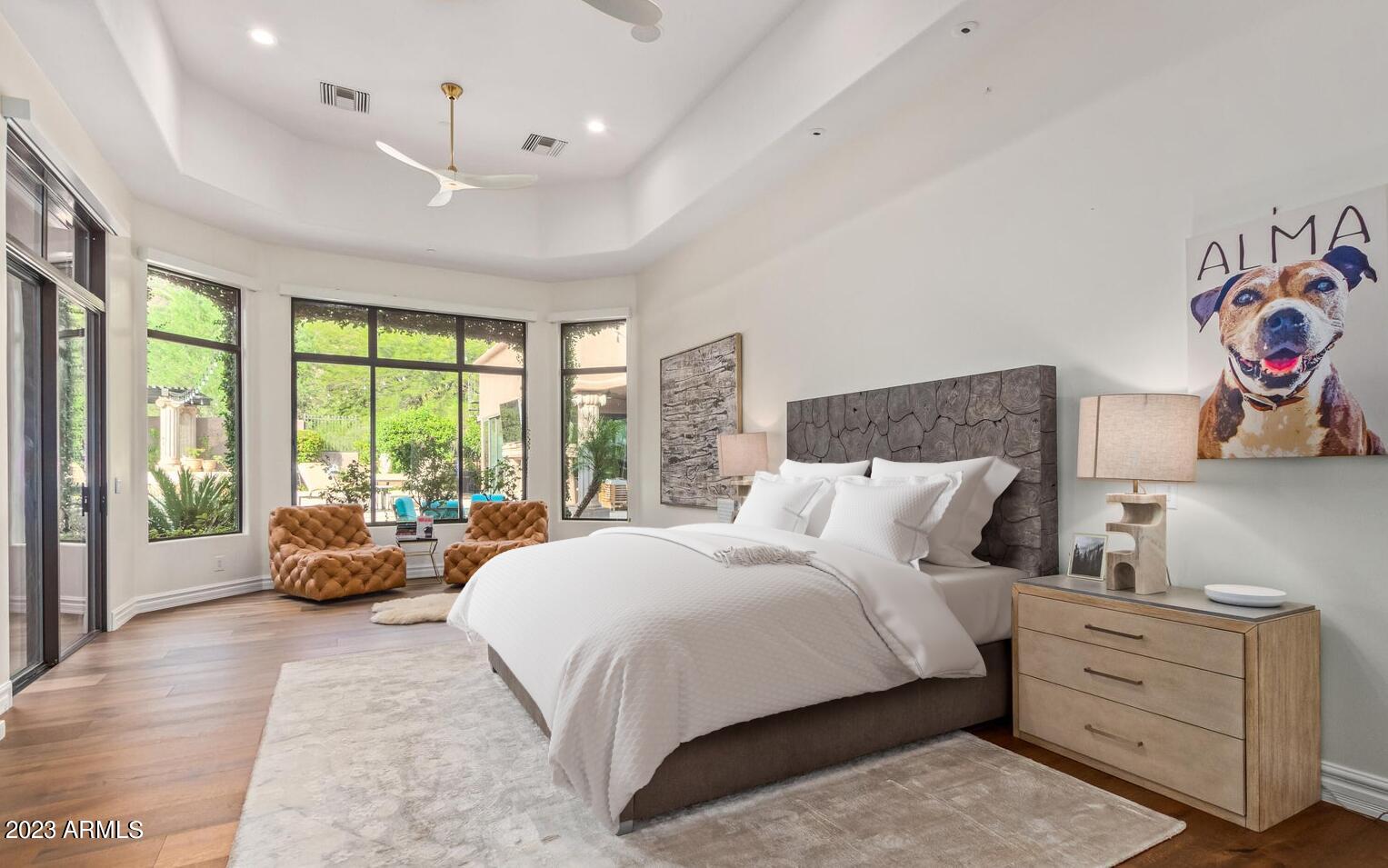 16469 North 113th Way Scottsdale, AZ 85255 - Photo 21 of 47 a bedroom with a bed and large windows