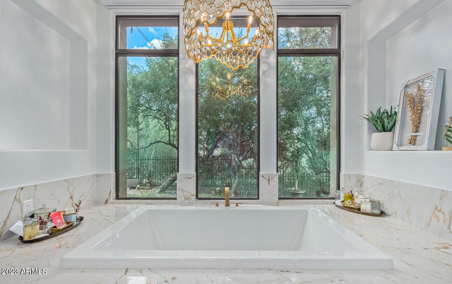 16469 North 113th Way Scottsdale, AZ 85255 - Photo 22 of 47 a bathroom with a tub and a window