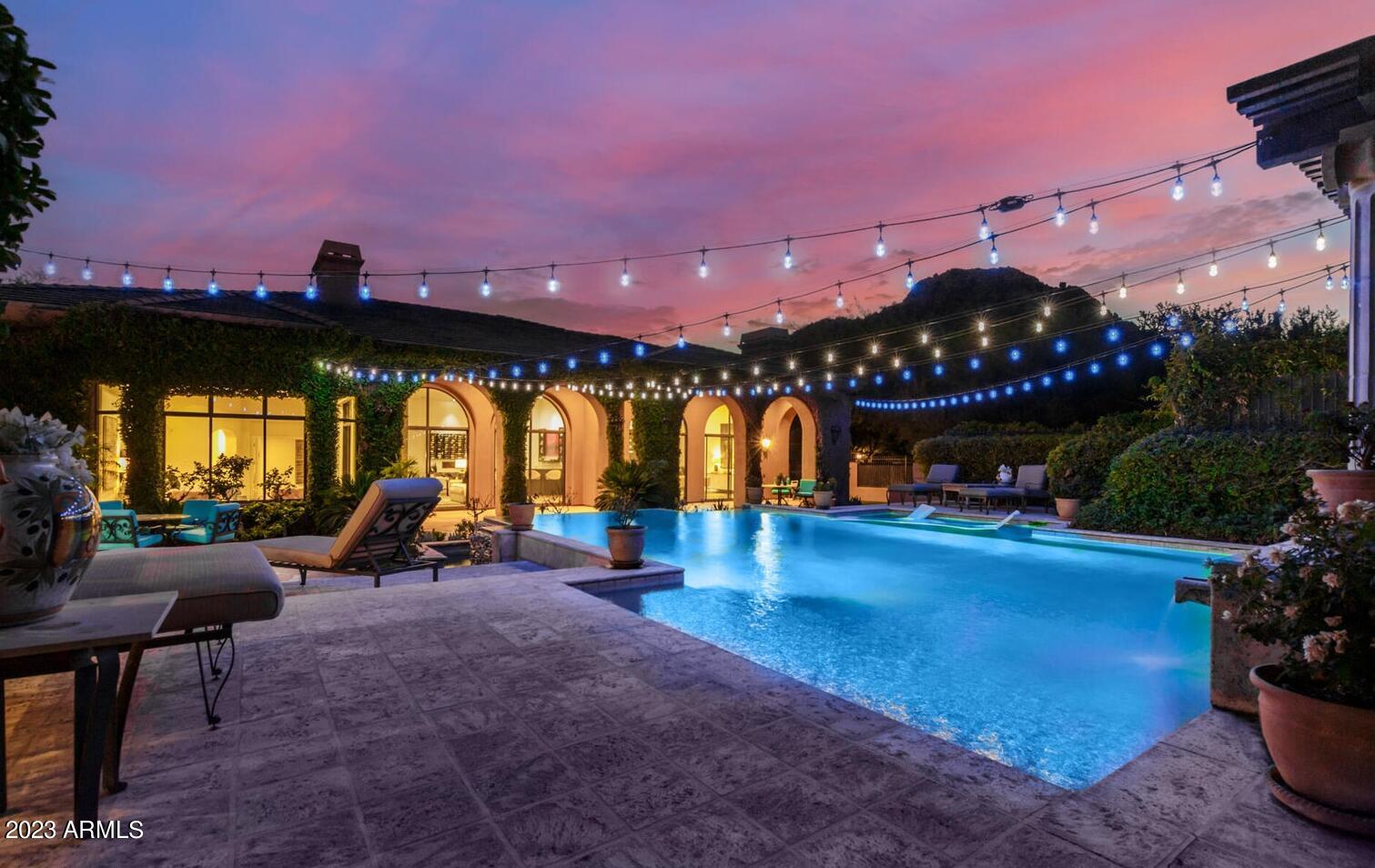 16469 North 113th Way Scottsdale, AZ 85255 - Photo 31 of 47 a view of a swimming pool with a seating space and fir pit